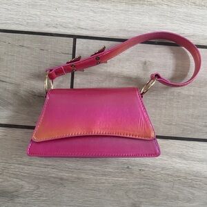 Small iridescent, pink purse with rhinestone butterflies